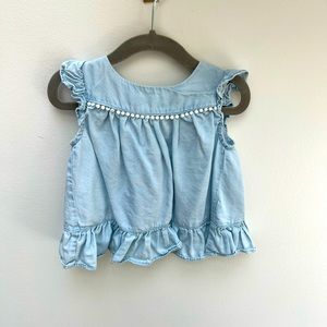 Chambray tunic with flutter sleeve and ruffle detail